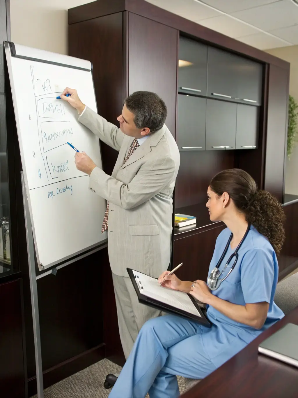 A close-up shot of a Vision Global accountant explaining tax strategies to a healthcare professional, highlighting the benefits of healthcare-specific tax planning.